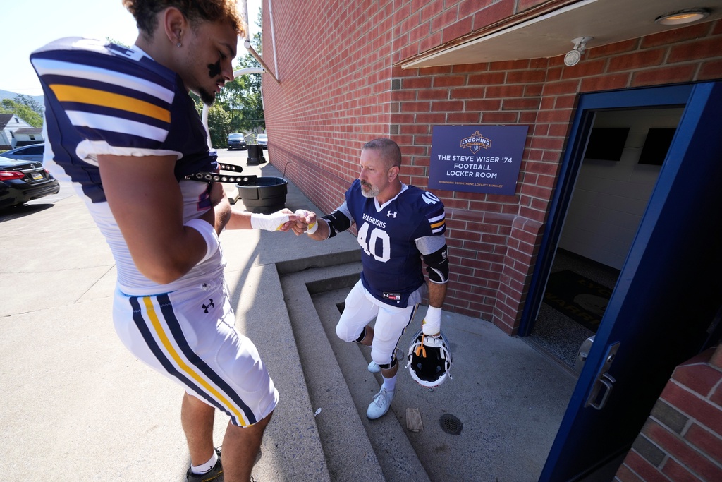 Lycoming College nose tackle Tom Cillo (40) heads for the field for warm ups before an NCAA Division III junior varsity college football game against King's College in Williamsport, Pa., Sunday, Sept. 28, 2025. (AP Photo/Gene J. Puskar)