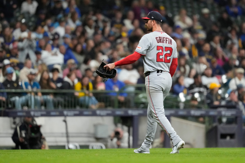 Washington Nationals' Foster Griffin walks to the dugout after being taken out during the sixth inning of a baseball game against the Milwaukee Brewers, Saturday, April 11, 2026, in Milwaukee. (AP Photo/Aaron Gash)