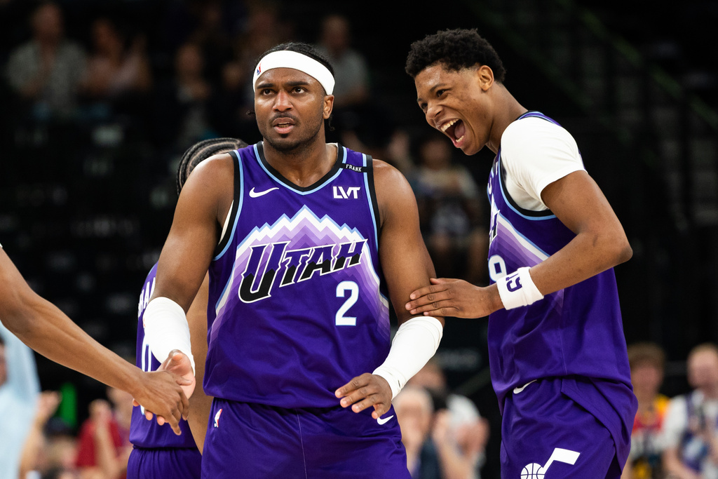 Utah Jazz forward Blake Hinson (2) and Utah Jazz forward Ace Bailey, right, celebrate a four-point play during the second half of an NBA basketball game against the Washington Wizards, Wednesday, March 25, 2026, in Salt Lake City. (AP Photo/Anna Fuder)