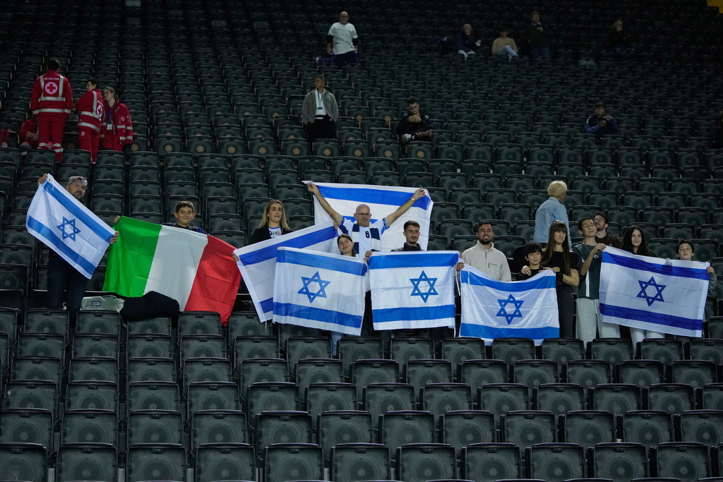 Israel's supporters cheer prior to the start of a World Cup 2026 Group I qualifying soccer match between Italy and Israel at the Bluenergy Stadium in Udine, Italy, Tuesday, Oct. 14, 2025. (AP Photo/Luca Bruno)