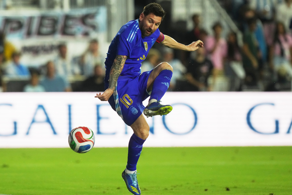Argentina's Lionel Messi (10) attempts a shot on goal during the first half of a friendly soccer match against Puerto Rico, Tuesday, Oct. 14, 2025, in Fort Lauderdale, Fla. (AP Photo/Marta Lavandier)