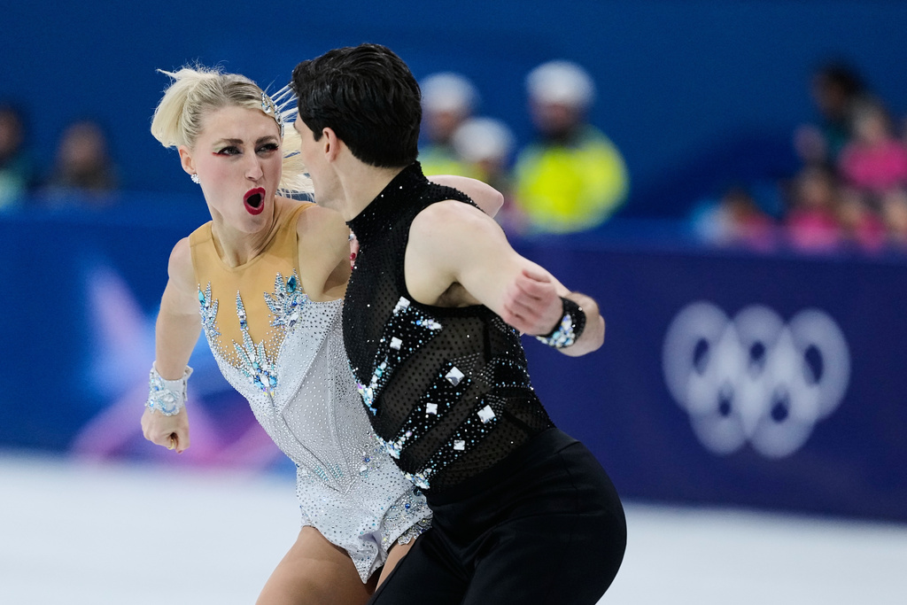 Piper Gilles and Paul Poirier of Canada compete during the rhythm dance in figure skating at the 2026 Winter Olympics, in Milan, Italy, Monday, Feb. 9, 2026. (AP Photo/Natacha Pisarenko)