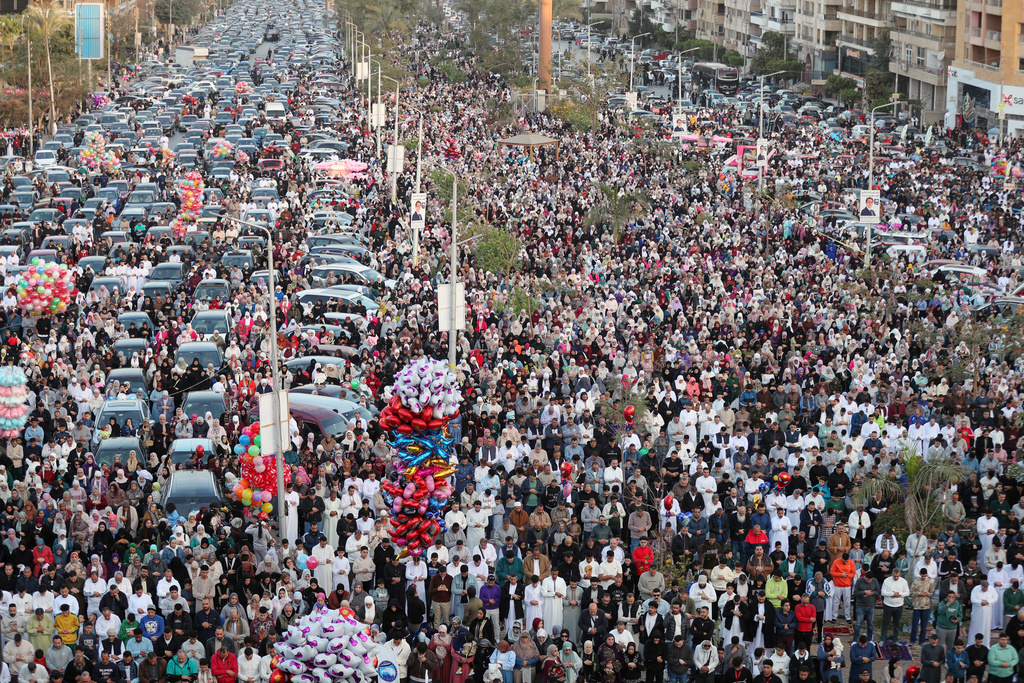 Thousands of Egyptian Muslims perform Eid al-Fitr prayers outside al-Seddik mosque in Cairo, Egypt, Friday, March 20, 2026. (AP Photo/Khaled el Fiqi)