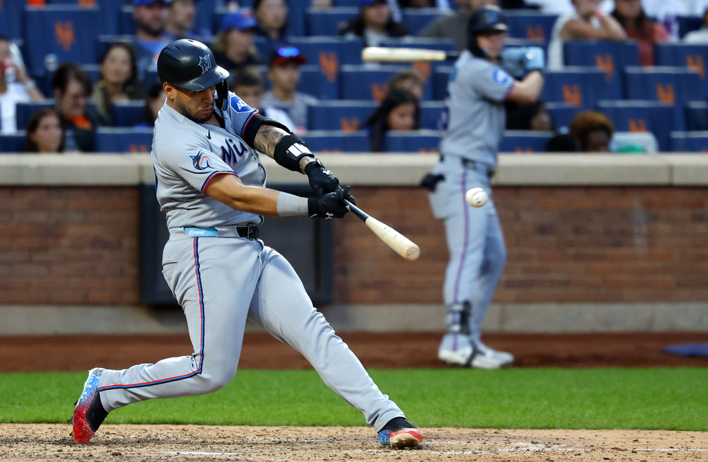 Miami Marlins' Agustín Ramírez hits double during the ninth inning of a baseball game against the New York Mets, Saturday, Aug. 30, 2025, in New York. (AP Photo/Noah K. Murray)