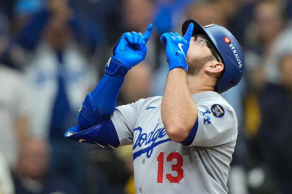 Los Angeles Dodgers' Max Muncy celebrates after a home run against the Milwaukee Brewers during the sixth inning in Game 2 of baseball's National League Championship Series, Tuesday, Oct. 14, 2025, in Milwaukee. (AP Photo/Brynn Anderson)