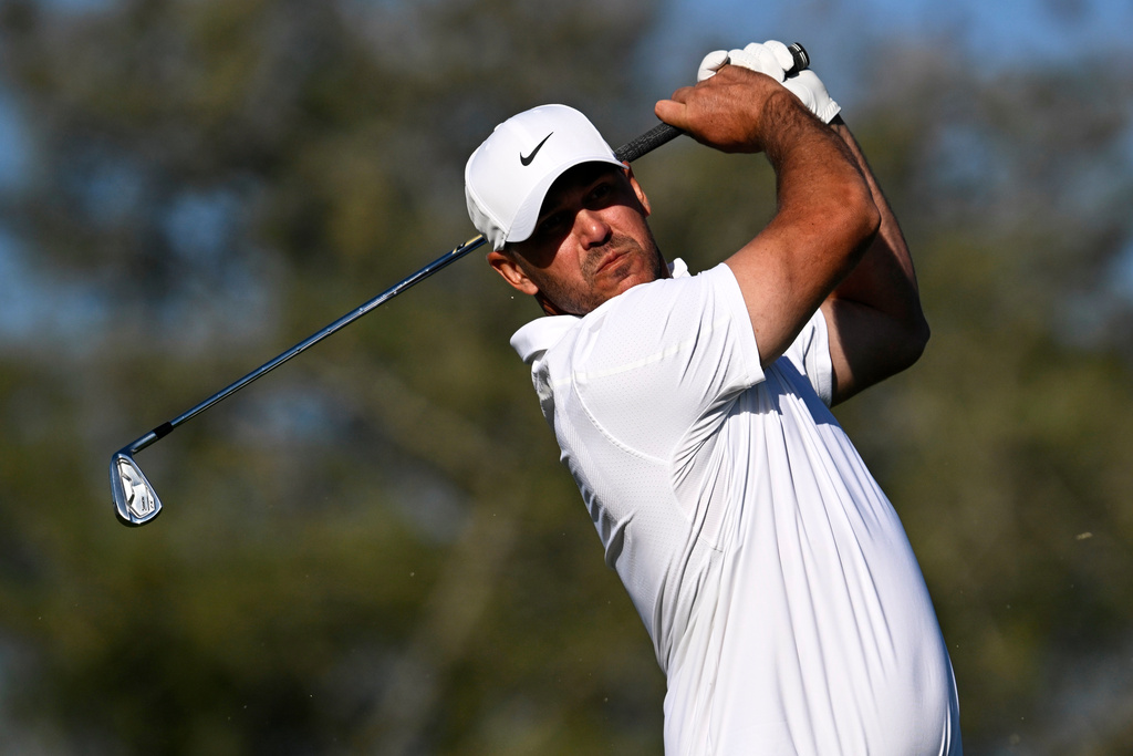 Brooks Koepka tees off on the eighth hole while playing the North Course at Torrey Pines during the second round of the Farmers Insurance Open golf tournament Friday, Jan. 30, 2026, in San Diego. (AP Photo/Denis Poroy)