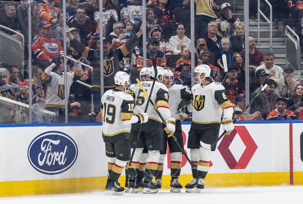 Vegas Golden Knights players celebrate a goal against the Edmonton Oilers during the second period of an NHL hockey game in Edmonton, Alberta, on Saturday April 4, 2026. (Jason Franson/The Canadian Press via AP)