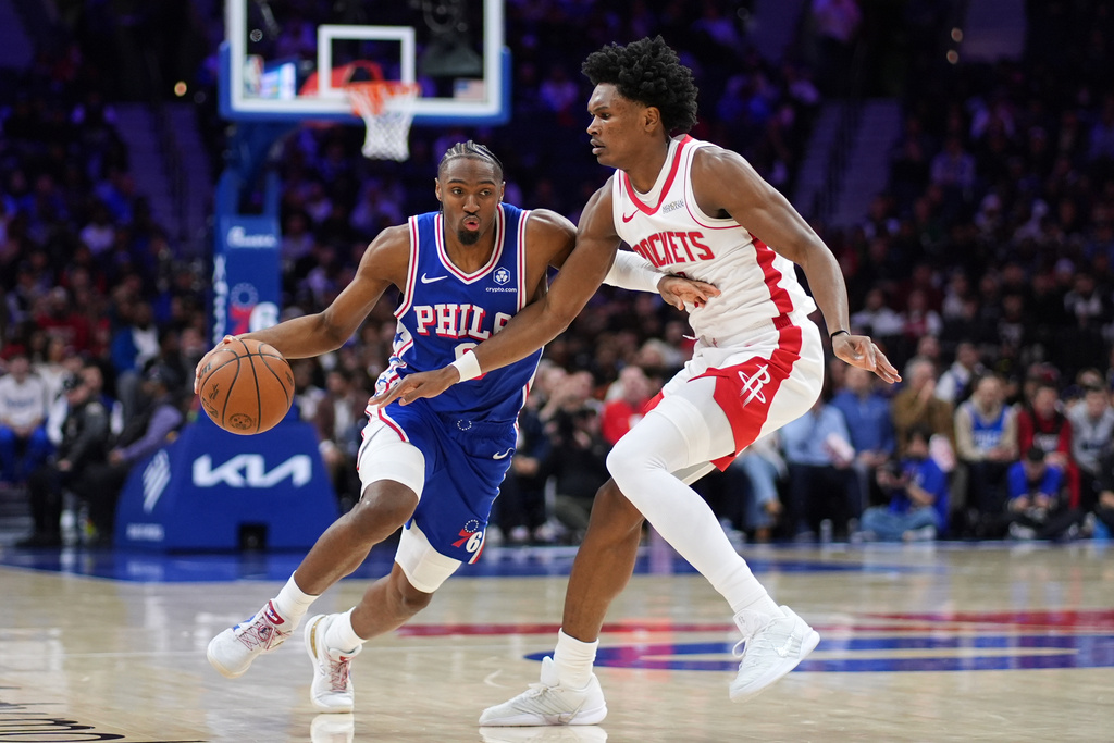 Philadelphia 76ers' Tyrese Maxey, left, tries to get past Houston Rockets' Amen Thompson during the first half of an NBA basketball game Thursday, Jan. 22, 2026, in Philadelphia. (AP Photo/Matt Slocum)