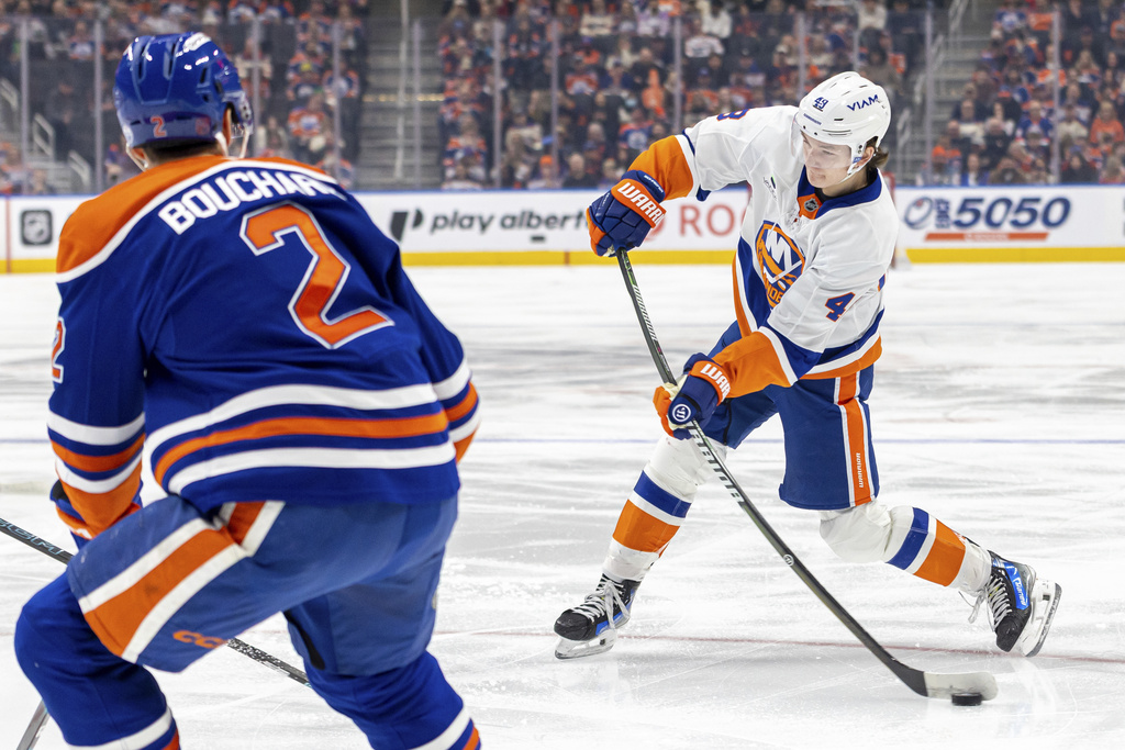 New York Islanders' Matthew Schaefer (48) takes a shot on net against the Edmonton Oilers during the first period of an NHL hockey game in Edmonton, Alberta, Thursday, Jan. 15, 2026. (Timothy Matwey/The Canadian Press via AP)