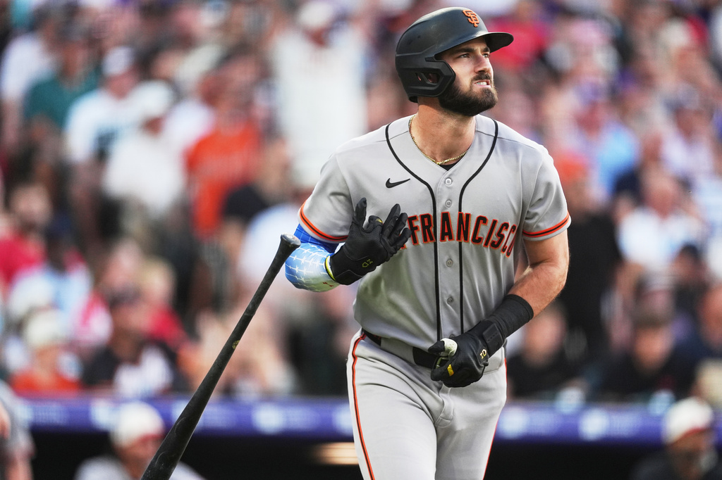 San Francisco Giants' Bryce Eldridge flips his bat as he heads up the first-base line after hitting a solo home run off Colorado Rockies starting pitcher Sean Sullivan in the third inning of a baseball game Saturday, July 4, 2026, in Denver. (AP Photo/David Zalubowski)