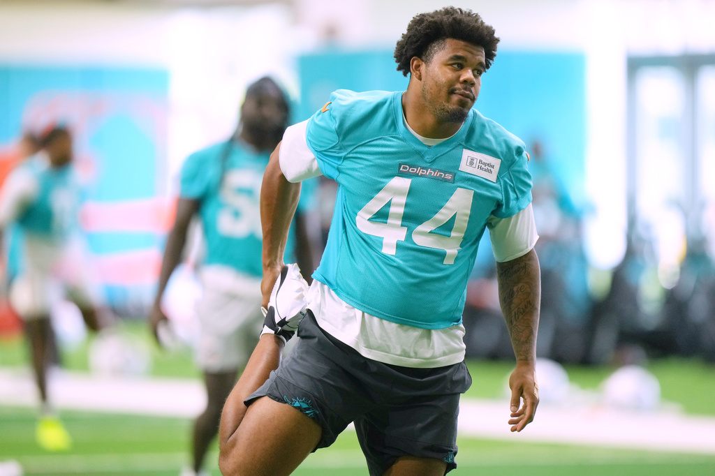 FILE - Miami Dolphins' Chop Robinson (44) warms up during practice at the team's NFL football training camp, July 31, 2026, in Miami Gardens, Fla. (AP Photo/Marta Lavandier, File)wld