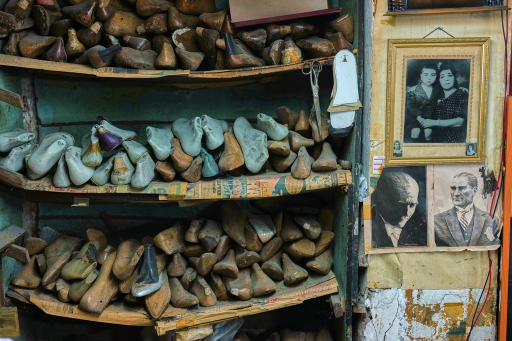Shoe molds are stacked at dance shoe maker Ercan Umay's workshop in Istanbul, Turkey, Tuesday, Jan. 20, 2026. (AP Photo/Francisco Seco)