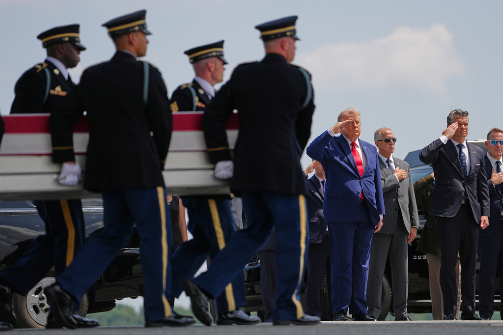 President Donald Trump and Secretary of Defense Pete Hegseth, salute as a U.S. Army carry team moves a transfer case containing the remains of Pvt. Isabella Gonzales of Carrollton, Texas, Wednesday, July 22, 2026, at Dover Air Force Base, Del. (AP Photo/Matt Rourke)