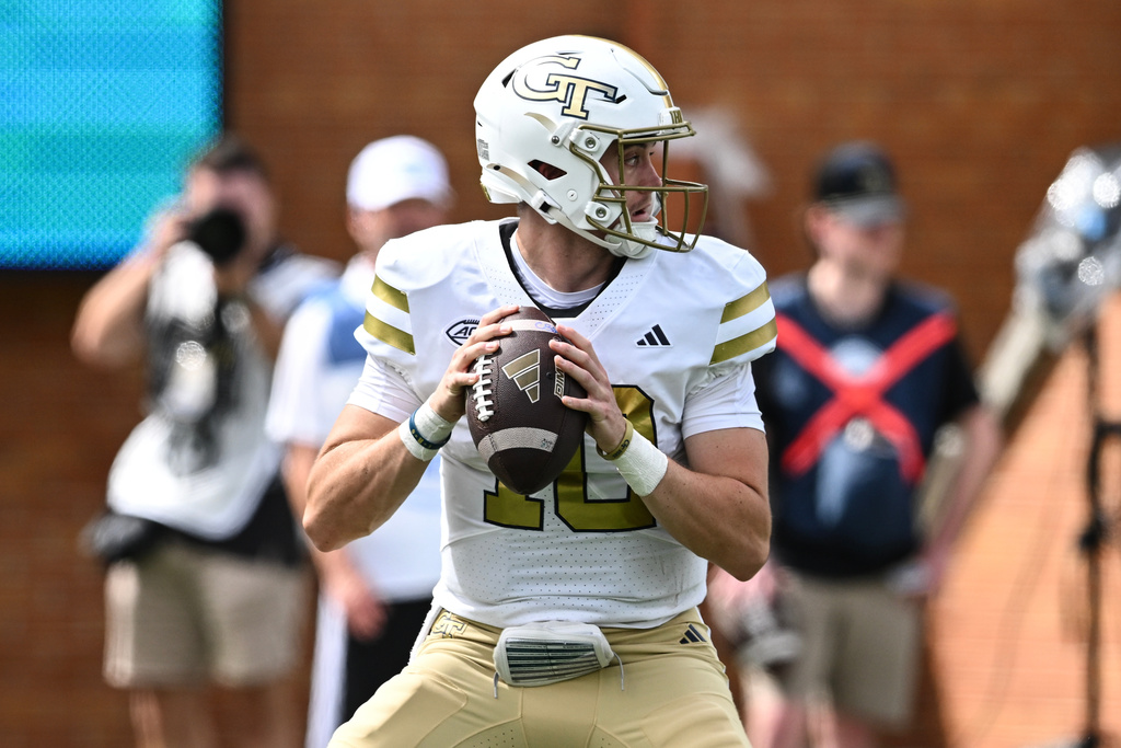 Georgia Tech quarterback Haynes King (10) drops back to pass during the first half of an NCAA college football game against Wake Forest, Saturday, Sept. 27, 2025, in Winston-Salem, N.C. (AP Photo/Matt Kelley)