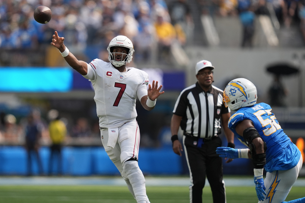 Arizona Cardinals quarterback Jacoby Brissett (7) passes as Los Angeles Chargers outside linebacker Khalil Mack (52) applies pressure during the first half of an NFL football game, Sunday, Sept. 13, 2026, in Inglewood, Calif. (AP Photo/Gregory Bull)