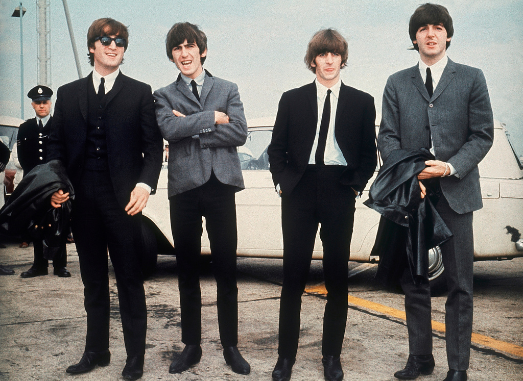 FILE - The Beatles, from left, John Lennon, George Harrison, Ringo Starr and Paul McCartney, arrive in Liverpool, England on July 10, 1964, for the premiere of their movie "A Hard Day's Night." (AP Photo, File)