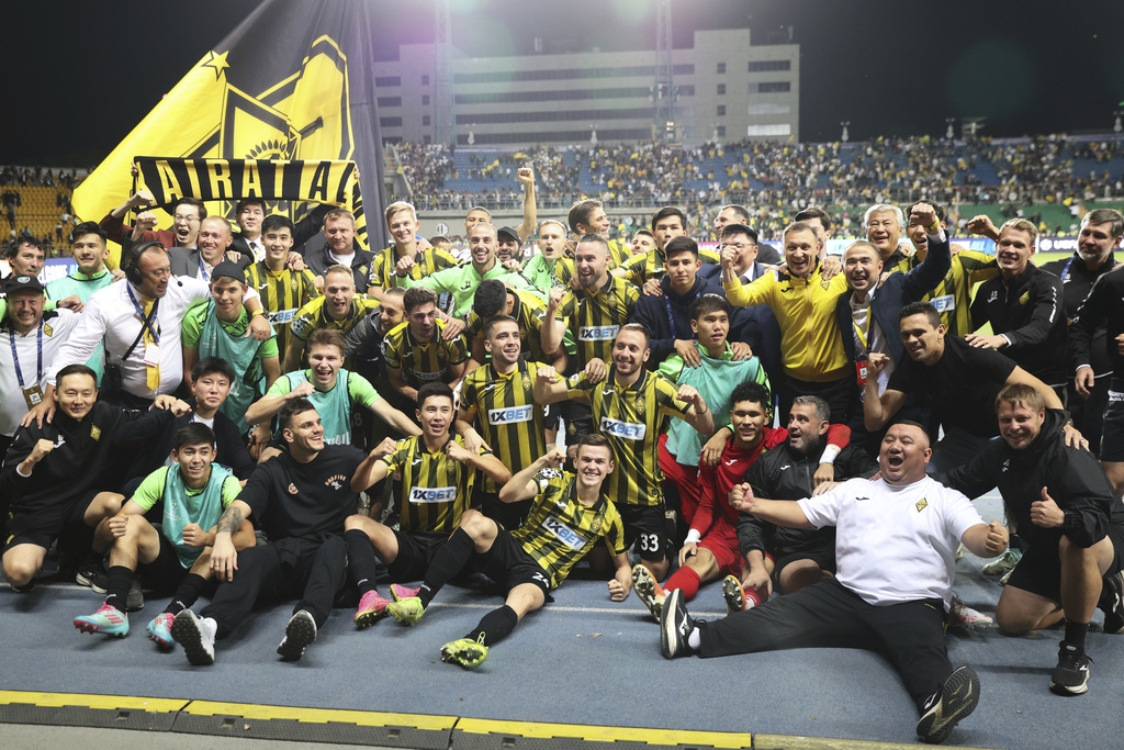Kairat players celebrate after winning the Champions League playoff second leg soccer match between Kairat and Celtic at Ortalyk stadium in Almaty, Kazakhstan, Wednesday, Aug. 27, 2025. (AP Photo/Alikhan Sariyev)