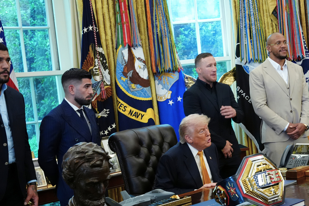President Donald Trump meets with UFC fighters, from left, Alex Pereira, Ilia Topuria, Justin Gaethje, and Ciryl Gane, Wednesday, May 6, 2026, in the Oval Office of the White House, in Washington. (AP Photo/Jacquelyn Martin)