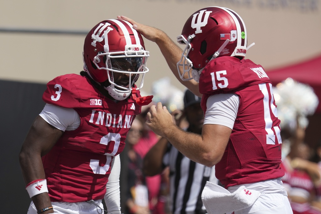 Indiana wide receiver Omar Cooper Jr. (3) reacts quarterback Fernando Mendoza (15) after a touchdown catch during the second half of an NCAA college football game against Kennesaw State, Saturday, Sept. 6, 2025, in Bloomington, Ind. (AP Photo/Darron Cummings)