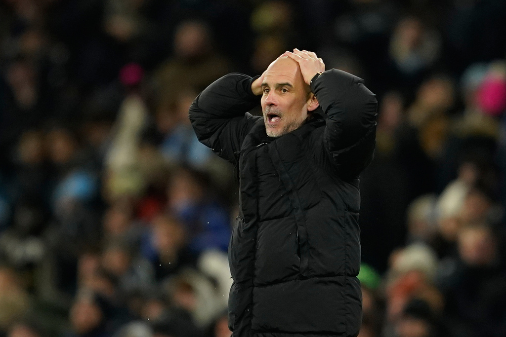 Manchester City head coach Pep Guardiola reacts after Erling Haaland missed a scoring opportunity during the English Premier League soccer match between Manchester City and Brighton and Hove Albion in Manchester, England, Wednesday, Jan. 7, 2026. (AP Photo/Dave Thompson)