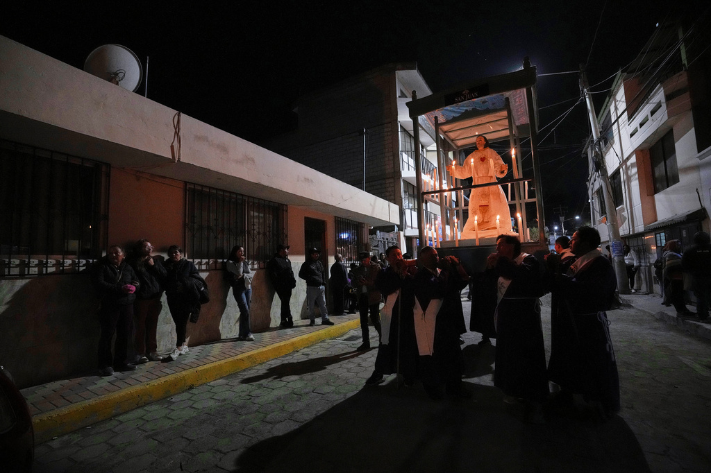 Parishioners take part in a Holy Week procession in Puellaro, Ecuador, Tuesday, March 31, 2026. (AP Photo/Dolores Ochoa)