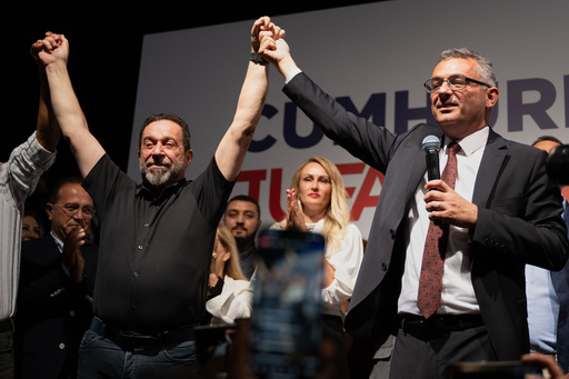 Turkish Cypriot newly elected leader Tufan Erhurman, right, and Serdar Denktash, son of the former Turkish Cypriot leader Rauf Denktash, celebrate after winning the leadership election in the Turkish occupied northern part of the divided capital Nicosia, Cyprus, Sunday, Oct. 19, 2025. (AP Photo/Nedim Enginsoy) Turkish Cypriot newly elected leader Tufan Erhurman, right, and Serdar Denktash, son of the former Turkish Cypriot leader Rauf Denktash, celebrate after winning the leadership election in the Turkish occupied northern part of the divided capital Nicosia, Cyprus, Sunday, Oct. 19, 2025. (AP Photo/Nedim Enginsoy)