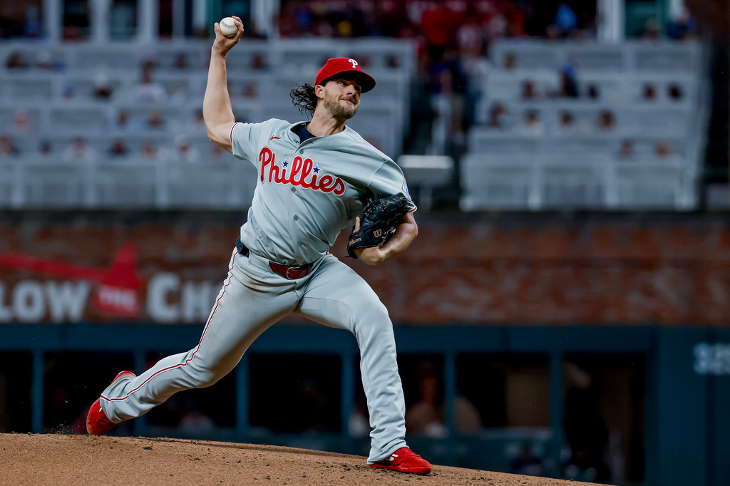 Philadelphia Phillies pitcher Aaron Nola delivers to an Atlanta Braves batter during the first inning of a baseball game, Friday, Sept. 11, 2026, in Atlanta. (AP Photo/Erik S. Lesser)