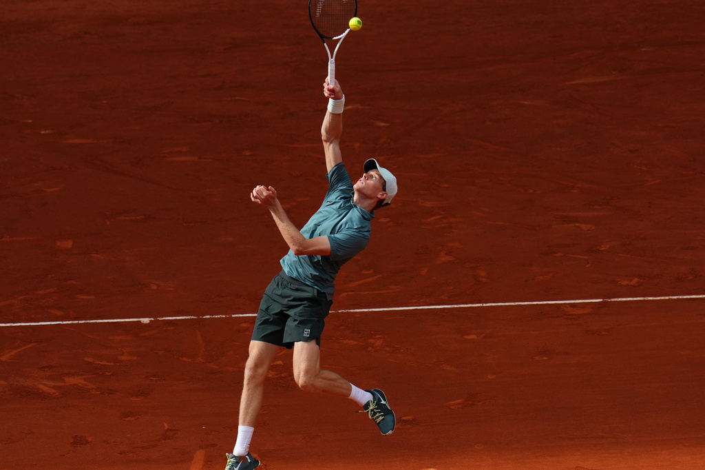 Jannik Sinner, of Italy, returns the ball to Alexander Zverev, of Germany, during their men's singles tennis final match at the Madrid Open tennis tournament in Madrid, Spain, Sunday, May 3, 2026. (AP Photo/Manu Fernandez)