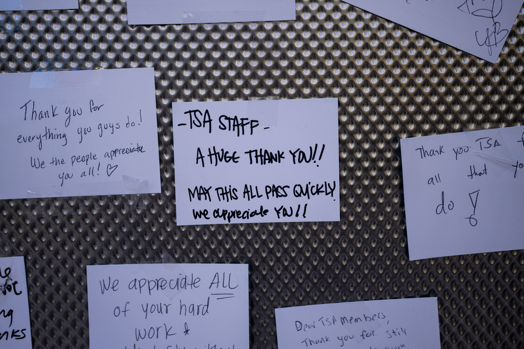 Messages written for TSA agents are displayed on a board at Los Angeles International Airport in Los Angeles, Friday, March 27, 2026. (AP Photo/Jae C. Hong)