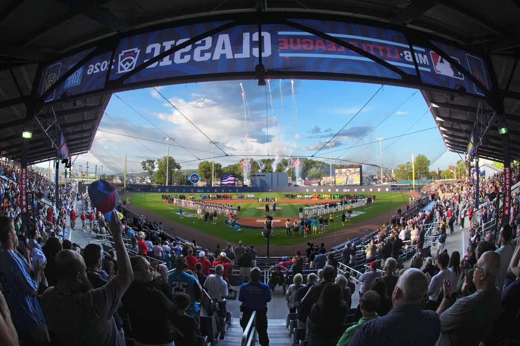 In this photo taken with a fisheye lens, fans fill the ballpark for the opening ceremony before the Little League Classic baseball game between the Milwaukee Brewers and the Atlanta Braves at Bowman Field in Williamsport, Pa., Sunday, Aug. 23, 2026. (AP Photo/Gene J. Puskar)