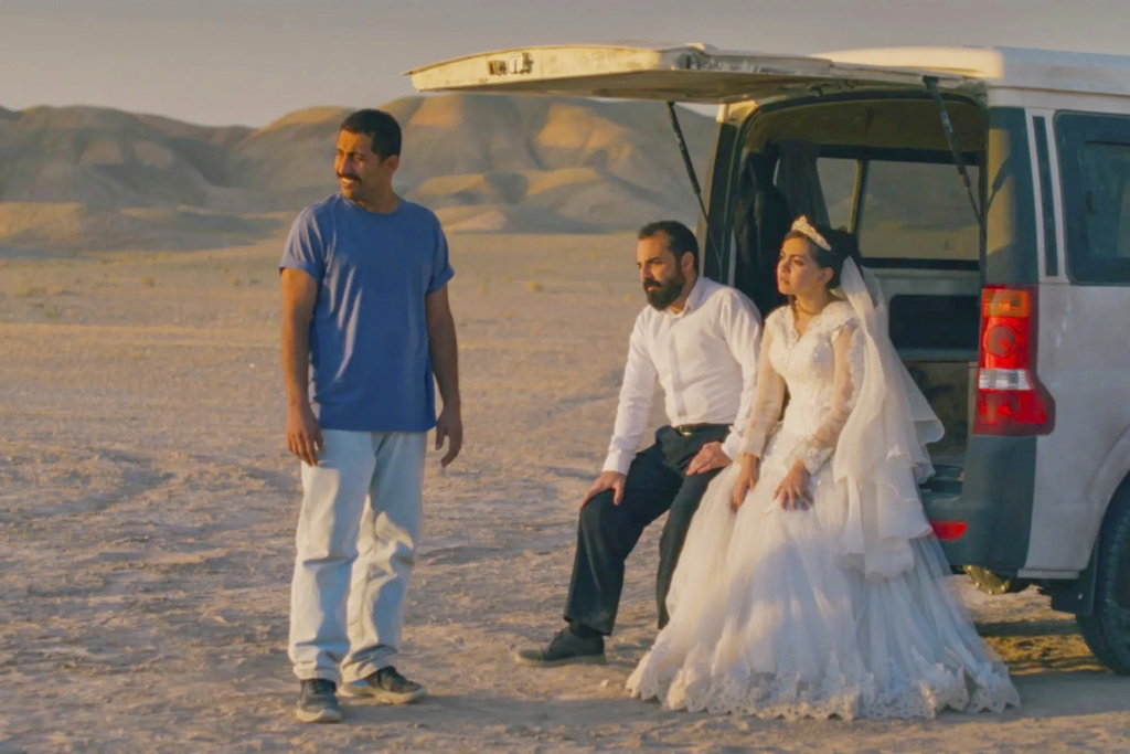 This image released by Neon shows, from left, Mohamad Ali Elyasmehr as Hamid, Majid Panahi as Ali, Hadis Pakbaten as Goli, in a scene from "It Was Just An Accident." (Neon via AP)