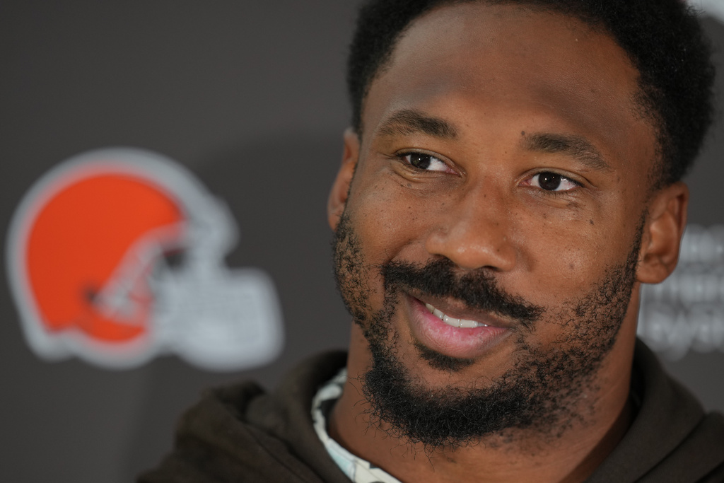 Cleveland Browns defensive end Myles Garrett (95) speaks during a press conference at an NFL football practice at The Grove in Watford, England, Friday, Oct. 3, 2025. (AP Photo/Kin Cheung)