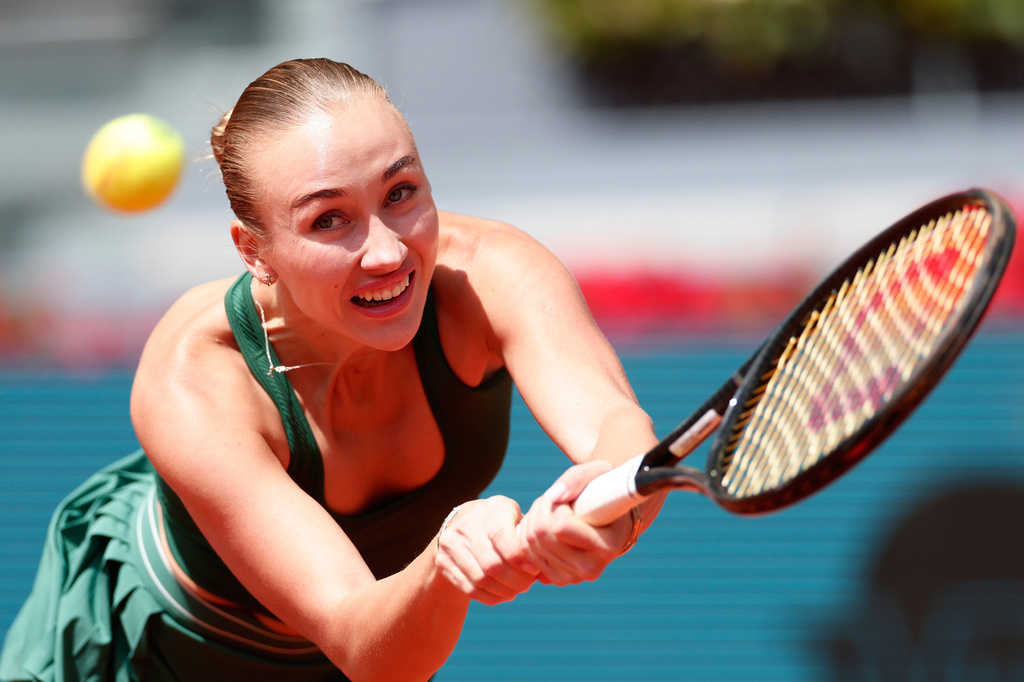 Anastasia Potapova of Russia returns the ball to Karolina Pliskova of the Czech Republic during the Madrid Open tennis tournament in Madrid, Wednesday, April 29, 2026. (AP Photo/Pablo Garcia)