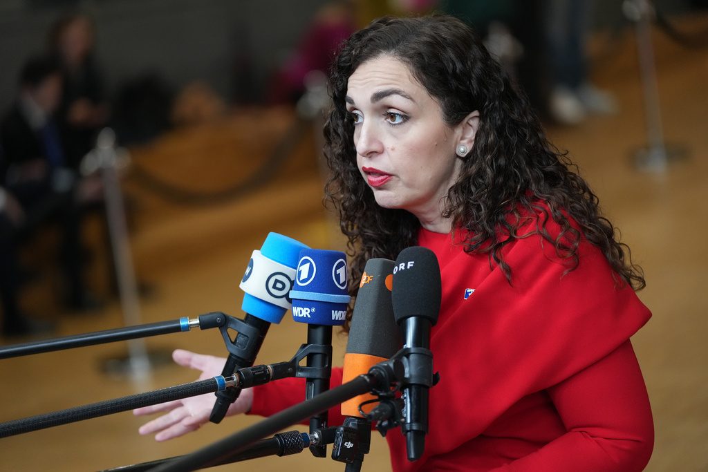 FILE - Kosovo's President Vjosa Osmani-Sadriu speaks with the media as she arrives for an EU-Western Balkans Summit at the European Council building in Brussels, Wednesday, Dec. 17, 2025. (AP Photo/Virginia Mayo, File)