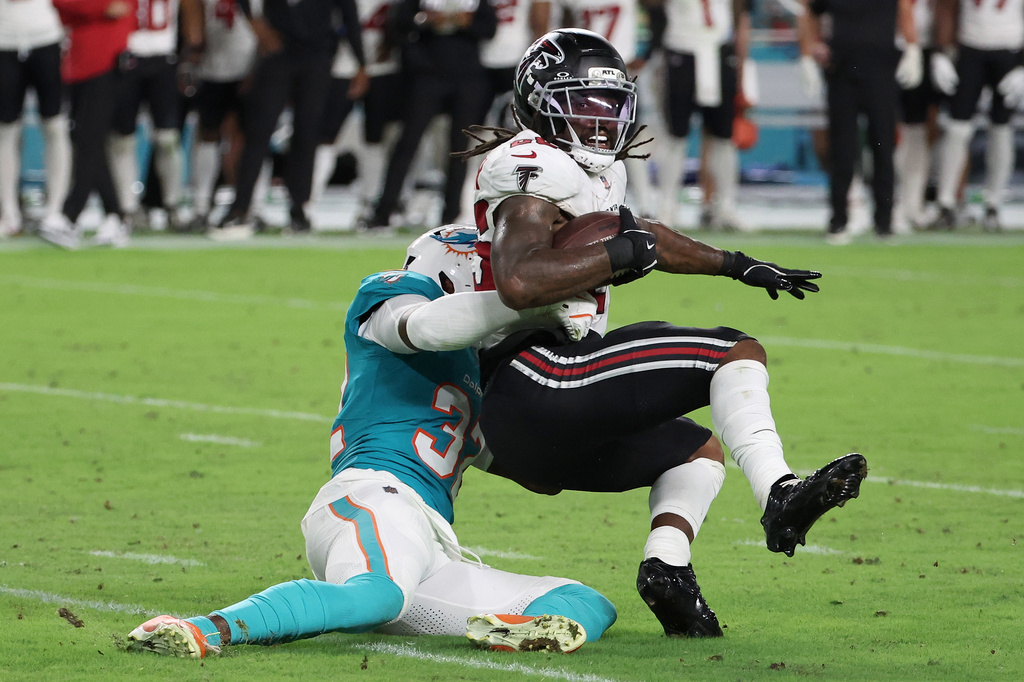 Atlanta Falcons running back Tyler Goodson, right, is tackled by Miami Dolphins defensive back Lonnie Johnson Jr. during the first half of an NFL preseason football game, Friday, Aug. 28, 2026, in Miami Gardens, Fla. (AP Photo/David Santiago)
