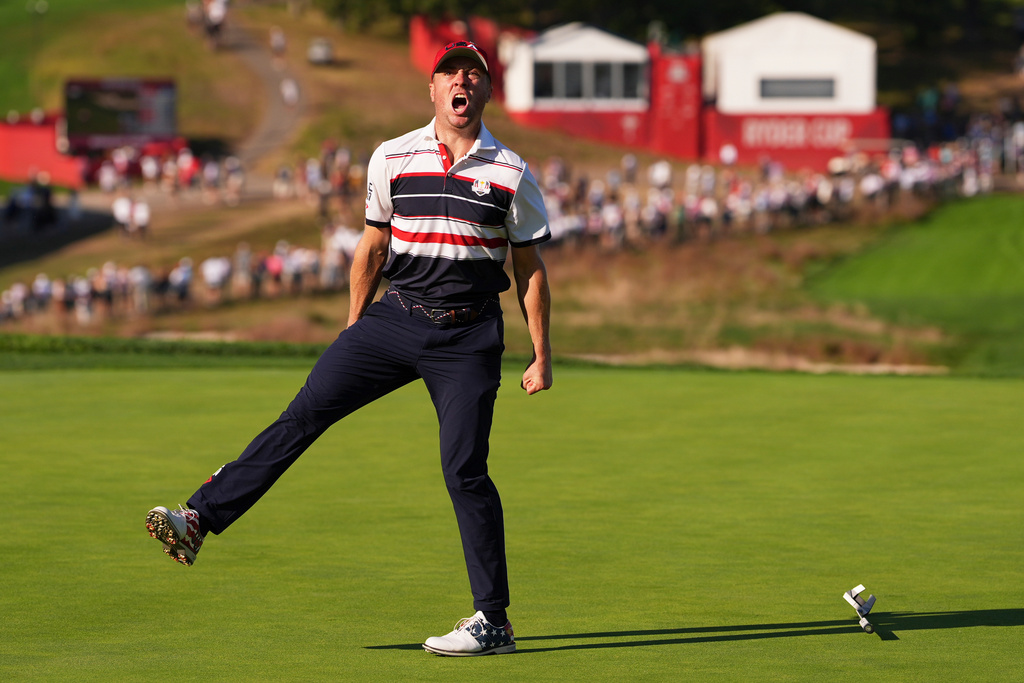 United States' Justin Thomas celebrates after a putt on the 18th hole during their singles match on the Bethpage Black golf course at the Ryder Cup golf tournament, Sunday, Sept. 28, 2025, in Farmingdale, N.Y. (AP Photo/Lindsey Wasson)