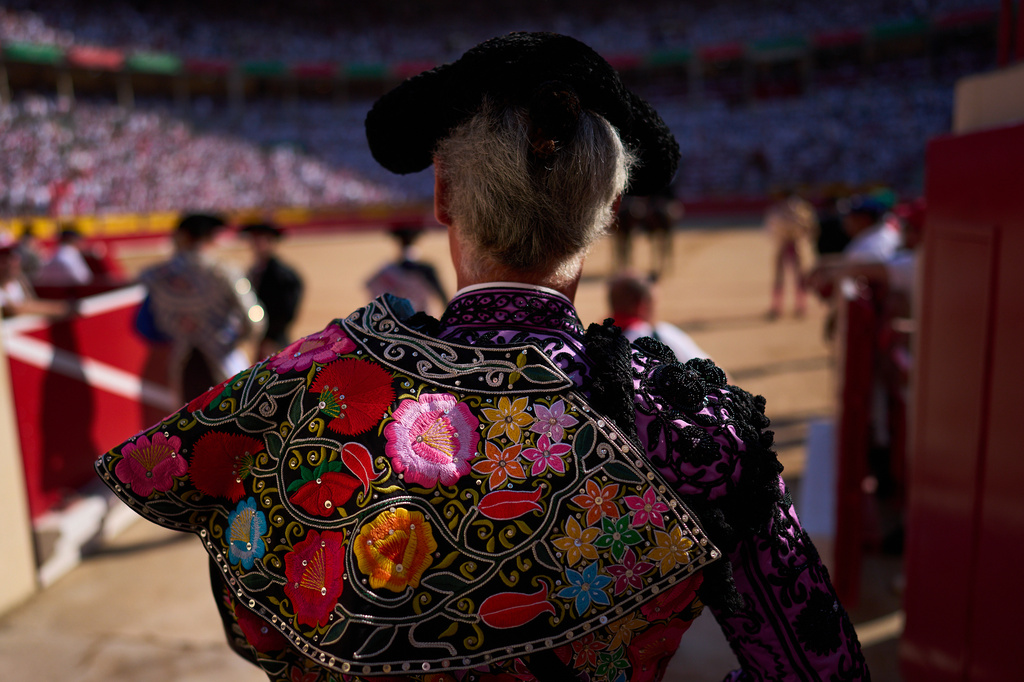 A member of a bullfighter's entourage enters the ring during a bullfight at the San Fermín festival in Pamplona, northern Spain, Tuesday, July 7, 2026. (AP Photo/Miguel Oses)