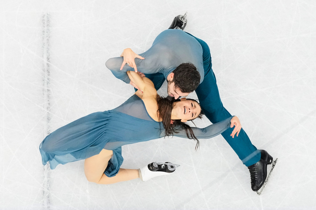 Laurence Fournier Beaudry and Guillaume Cizeron of France compete during the ice dancing free skate in figure skating at the 2026 Winter Olympics, in Milan, Italy, Wednesday, Feb. 11, 2026. (AP Photo/Bernat Armangue)