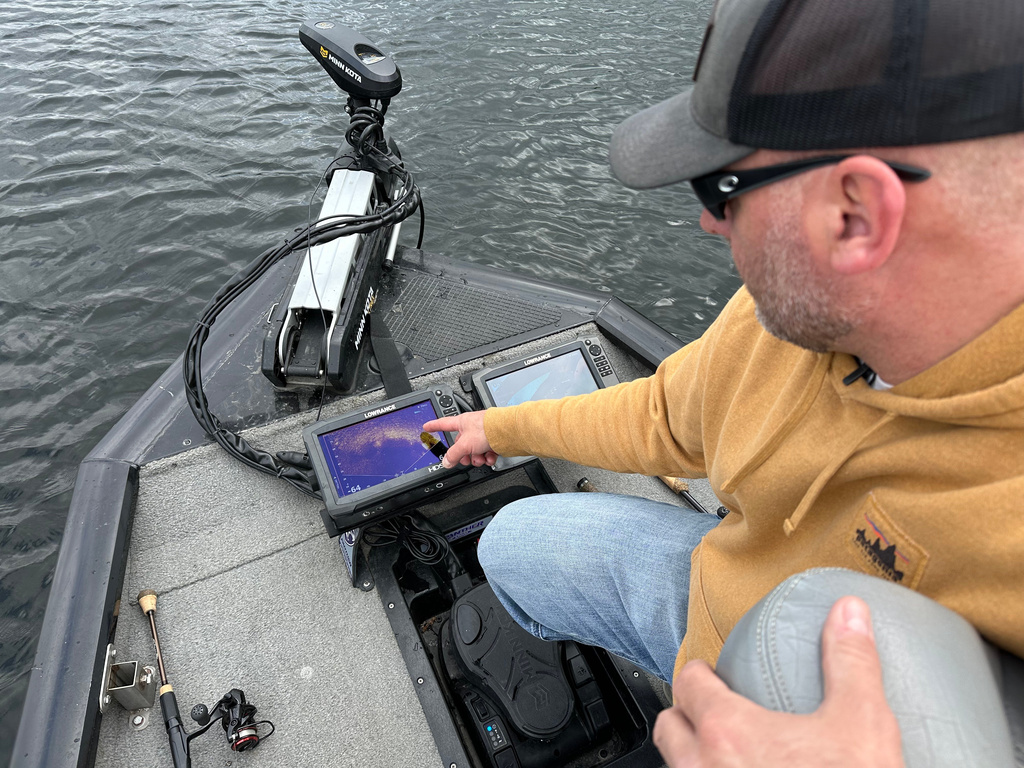 Terry Rehm points out a fish on his forward looking sonar system Saturday, May 23, 2026 in Nowthen, Minn. (AP Photo/Mark Vancleave)