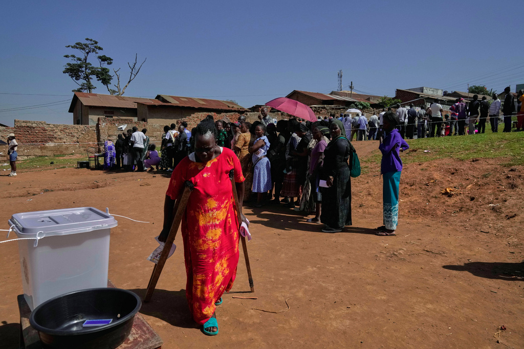 Voters line up to cast their ballots at a polling station, during the presidential election, in the capital, Kampala, Uganda, Thursday, Jan. 15, 2026. (AP Photo/Brian Inganga)