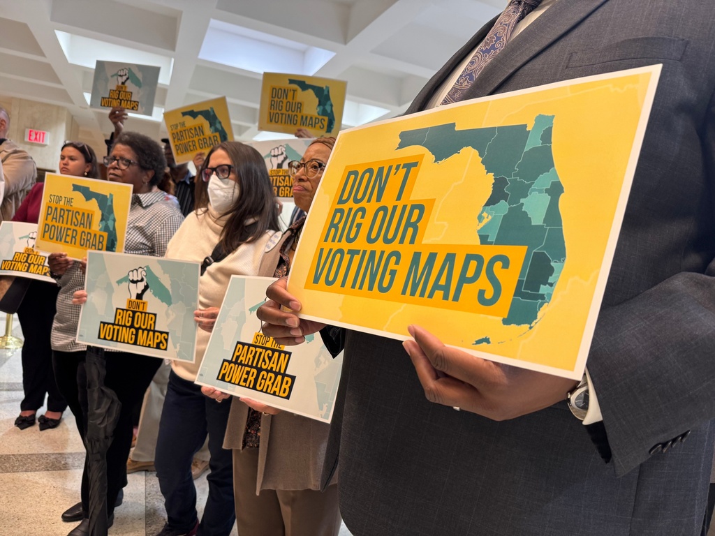 Opponents of mid-decade efforts to redraw congressional voting districts gather to protest in the Florida Capitol in Tallahassee, Fla., Dec. 2, 2025. (AP Photo/Kate Payne)