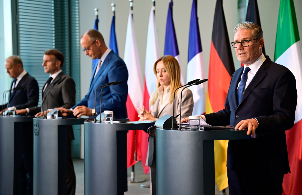 From left: Polish Prime Minister Donald Tusk, French President Emmanuel Macron, German Chancellor Friedrich Merz, Italy's Prime Minister Giorgia Meloni and Britain's Prime Minister Keir Starmer address the press at the end of their meeting of state leaders of the European Group of Five (E5) and the NATO Secretary General, in Berlin, Wednesday June 24, 2026. (John Macdougall/Pool Photo via AP)