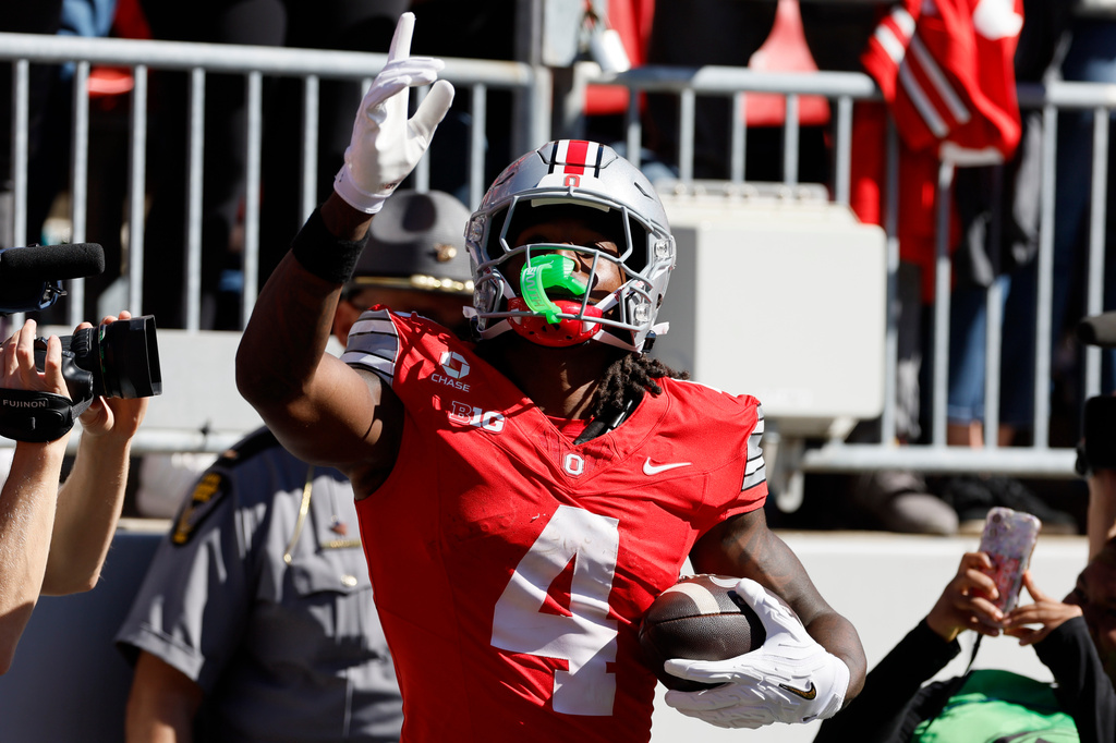 Ohio State wide receiver Jeremiah Smith celebrates his touchdown against Illinois during the second half of an NCAA college football game, Saturday, Sept. 26, 2026, in Columbus, Ohio. (AP Photo/Jay LaPrete)