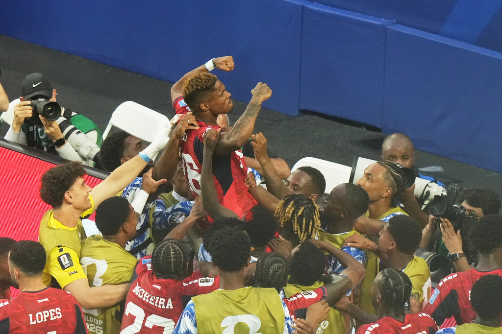 Cape Verde's Helio Varela, top, celebrates scoring his side's second goal against Uruguay during the World Cup Group H soccer match in Miami Gardens, Fla., Sunday, June 21, 2026. (AP Photo/Marta Lavandier)