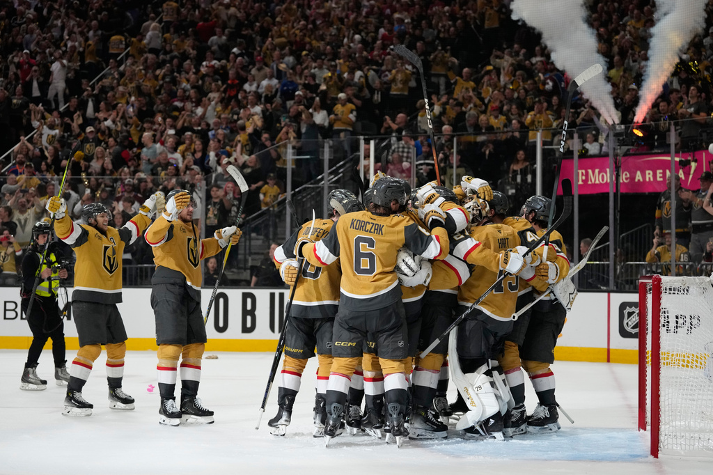 Vegas Golden Knights players celebrate after winning Game 4 of the Western Conference finals NHL hockey Stanley Cup playoff series against the Colorado Avalanche Tuesday, May 26, 2026, in Las Vegas. (AP Photo/John Locher)