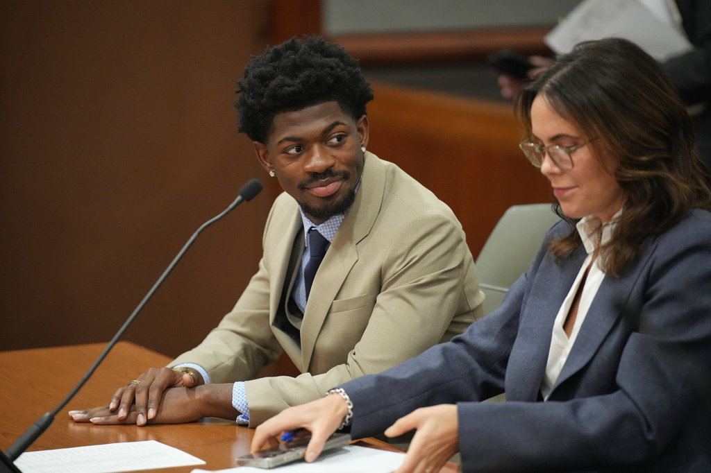 FILE - Lil Nas X, whose legal name is Montero Lamar Hill, appears in court charged with four felony counts, including three counts of battery with injury on a police officer in Los Angeles on March 12, 2026. (Daniel Cole/Pool Photo via AP, File)