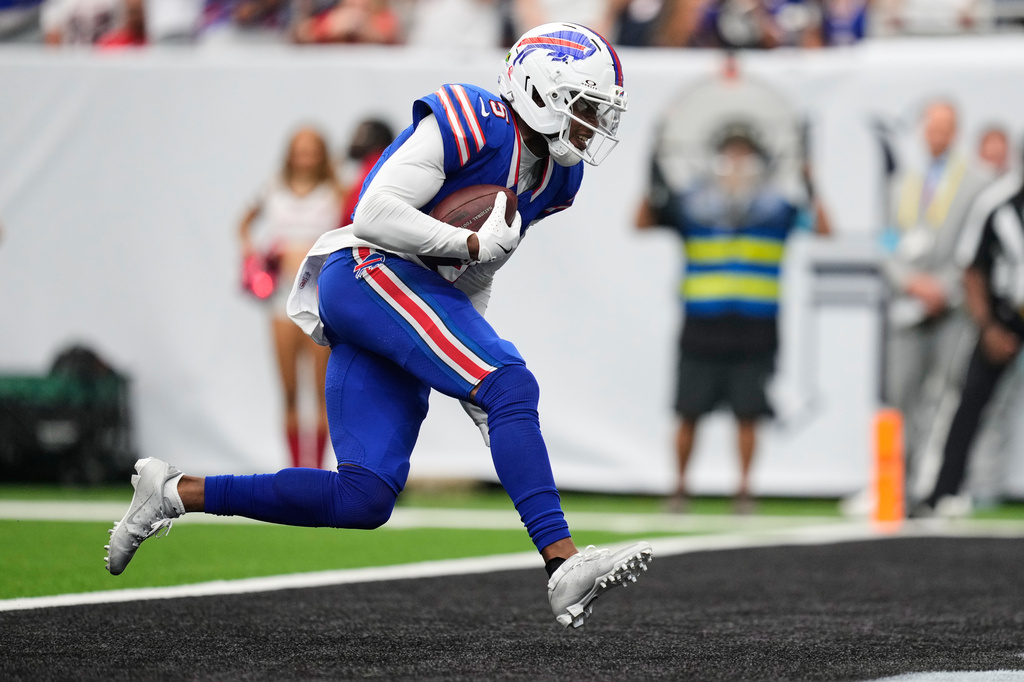 Buffalo Bills wide receiver Joshua Palmer runs the ball into the end zone for a touchdown during the second half of an NFL football game against the Houston Texans, Sunday, Sept. 13, 2026, in Houston. (AP Photo/Ashley Landis)