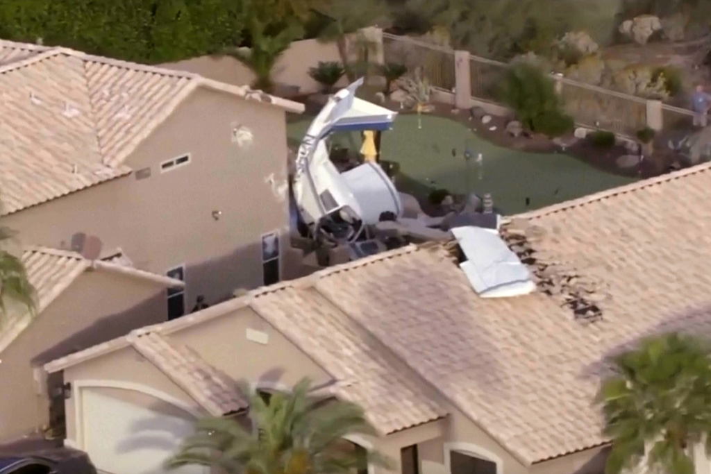 This image made from video provided by ABC15 Arizona shows a small plane that landed nose-down in a backyard, in north Phoenix, Wednesday, March 4, 2026. (ABC15 Arizona via AP)