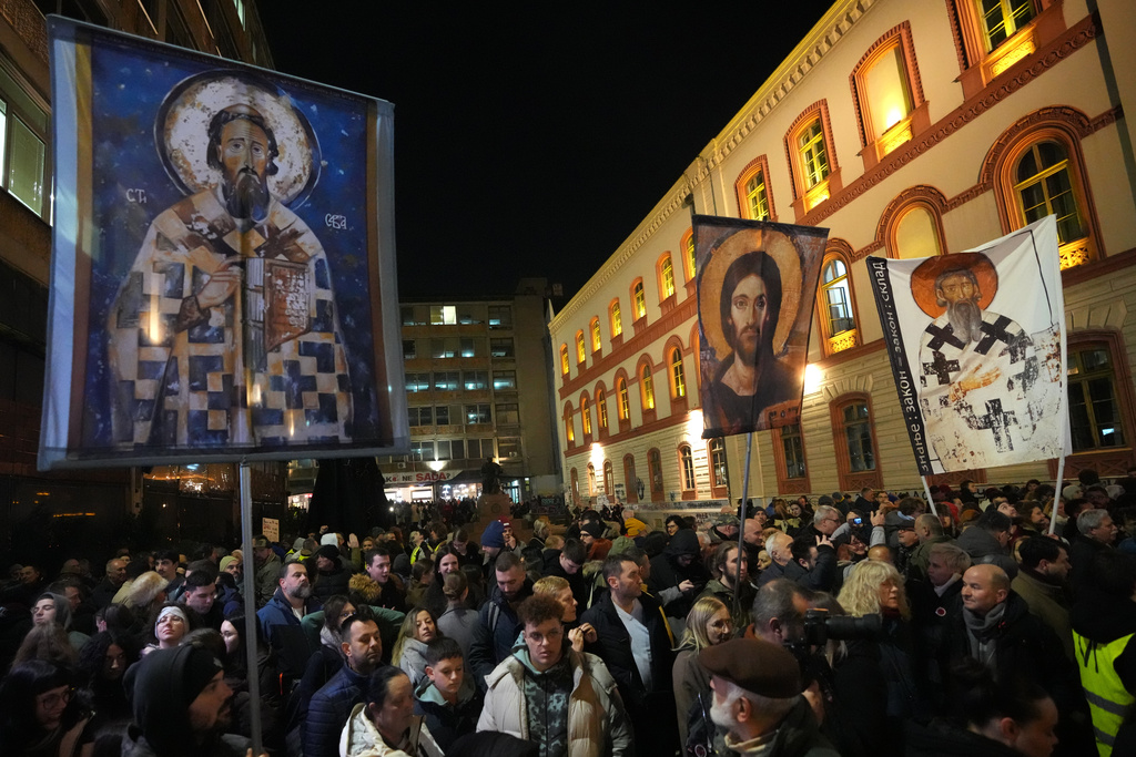 People attend a protest against a government crackdown on universities in Belgrade, Serbia, Tuesday, Jan. 27, 2026. (AP Photo/Darko Vojinovic)