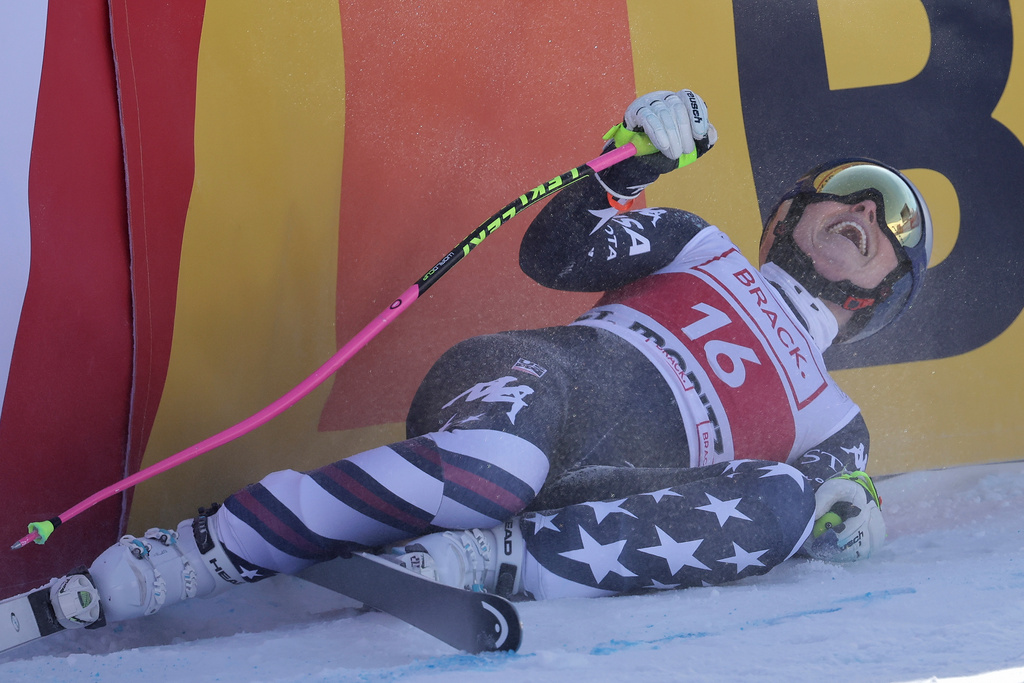 United States' Lindsey Vonn celebrates at the finish area of an alpine ski, women's World Cup downhill in St. Moritz, Switzerland, Friday, Dec.12, 2025. (AP Photo/Luciano Bisi)
